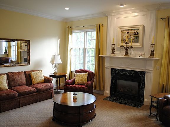 Recessed lighting throughout. Decorative molding around fireplace.