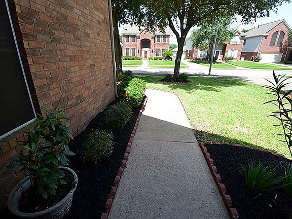 A view of the walkway from the front porch.