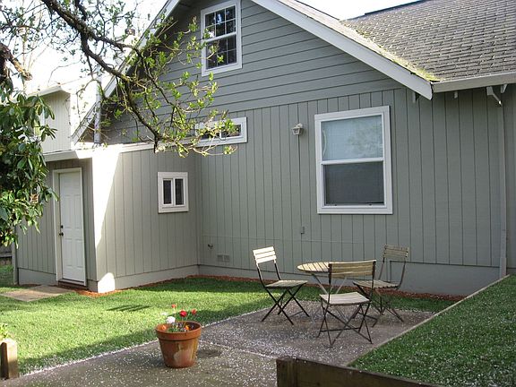 View of backyard and attached shed.