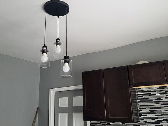 Freshly painted kitchen with beautiful tile and newer cabinets