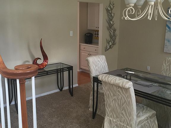 Dining room with adjacent coffee bar at rear staircase