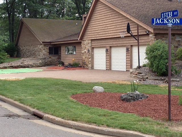 Front featuring 3 car garage