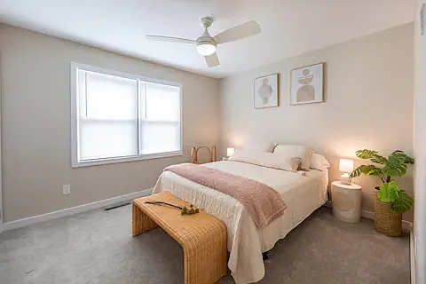 Second bedroom also boasts blackout curtains, large closet and ceiling fan.