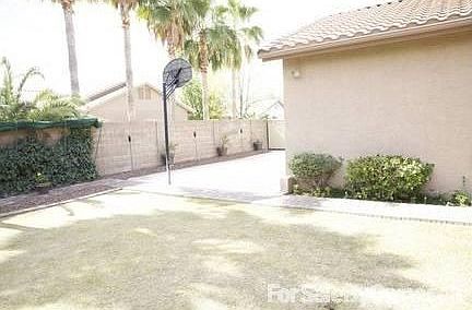 Beautiful back yard
						:
						Tiff lawn and basketball hoop, extra height fence.