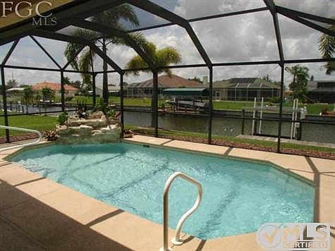 Heated Pool with LED Night Lights & Rock Waterfall