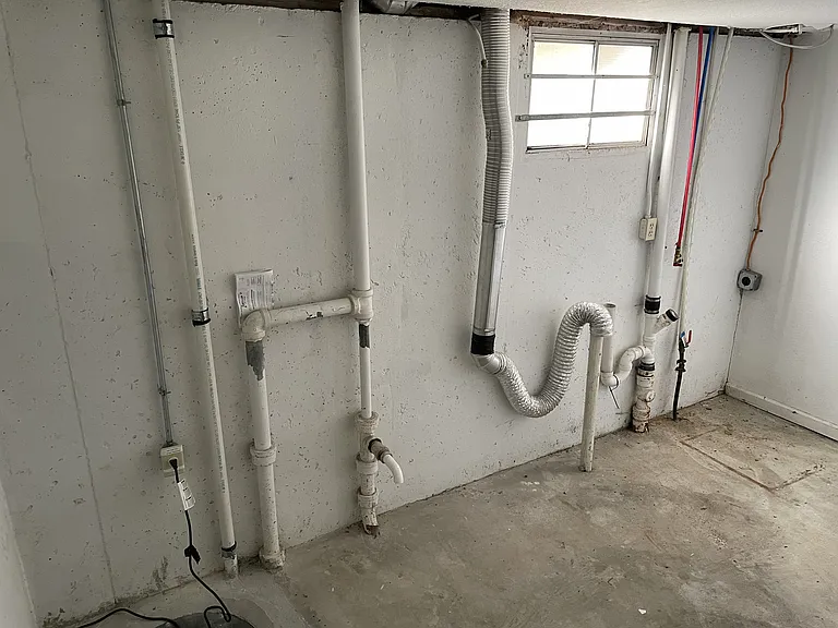 Laundry area in basement. Washer and dryer is not provided.