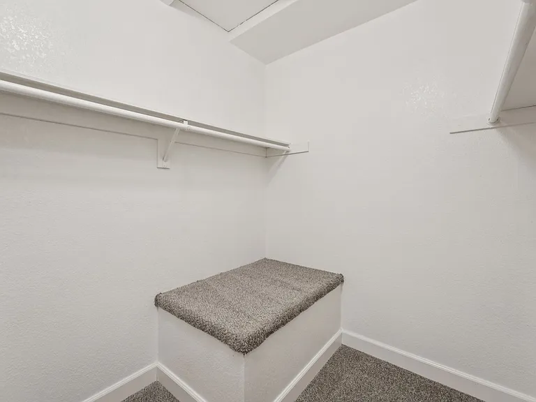 Walk in closet in townhome.