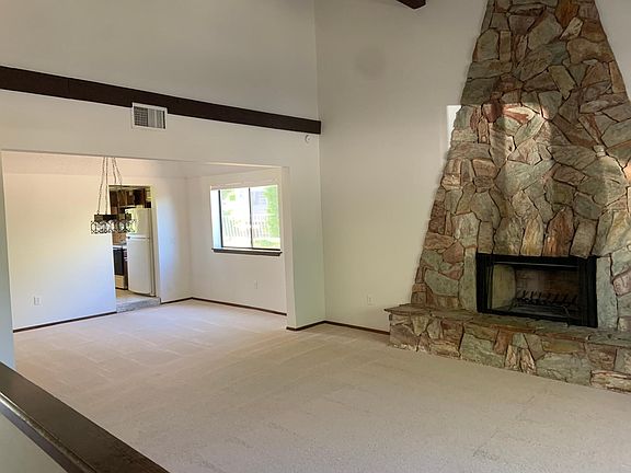 large front room/entry/ dining room with vaulted ceilings.