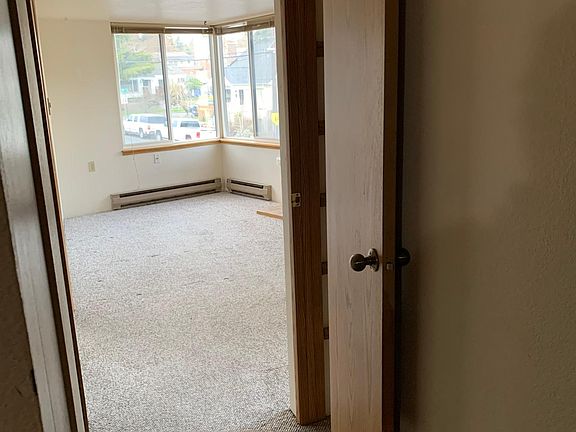 Living Room looking NE from hallway. Coat closet is to the right