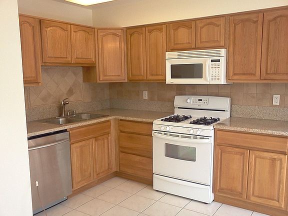 Full kitchen with oak wood cabinet downstairs