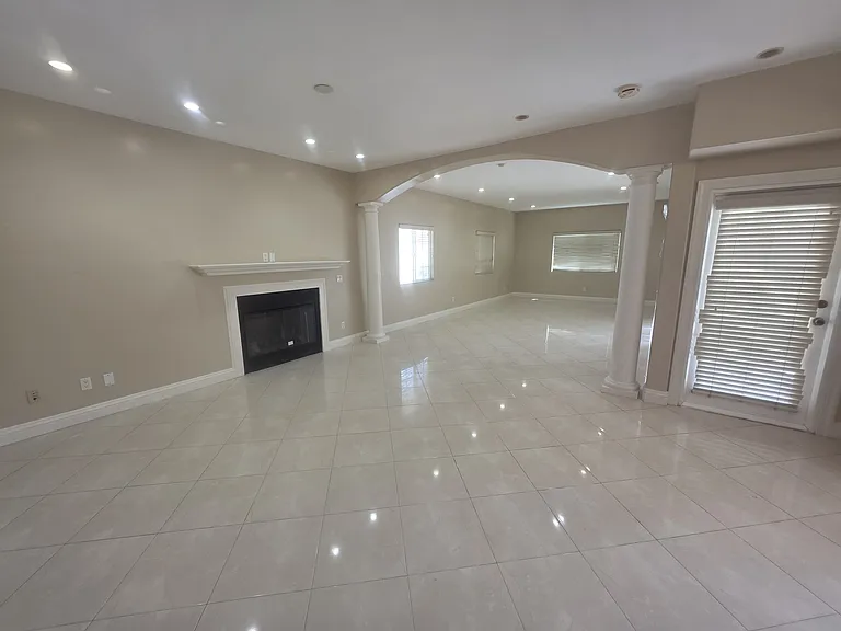 additional living space. Kitchen is located to the right in the picture