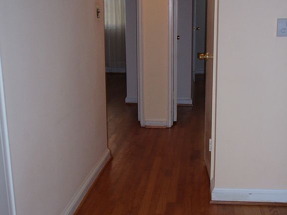 Hall to bedrooms, finished floors.