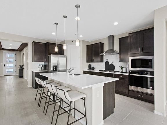 Built-in stainless steel appliances including gas cooktop range takes cooking to the next level in y