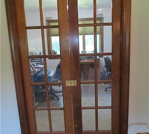 pocket door separating the living room and office/den