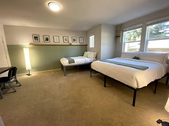 Catch some 'zzz's! This room is equipped with a king-size bed and desk/chair.