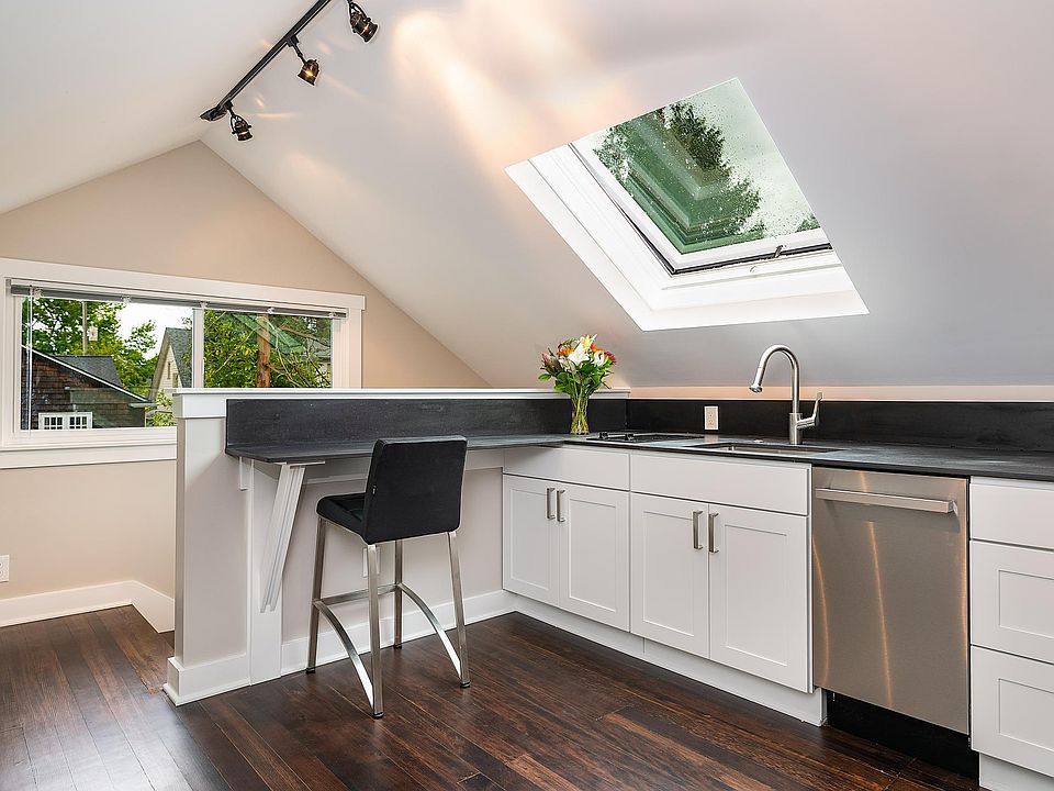 Kitchen with Breakfast Bar, Two-Burner Stove-Top, and 3-in-1 Countertop Air Fryer / Convection Oven / Microwave