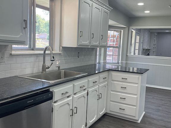 New granite, sink, faucet, hardware, and lighting