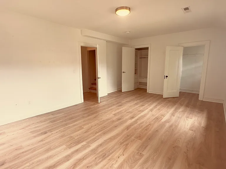 Spacious First-Floor Bedroom with Two Walk-In Closets