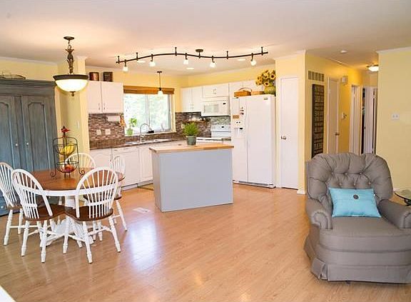 Kitchen with newer lighting, back splash and center island