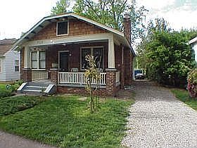 Front of house showing driveway.   Image courtesy peterrumsey.com