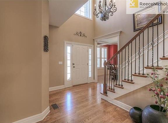 Gleaming hardwoods, iron spindles and wooden end caps on the stairs set the stage for this beautiful home.