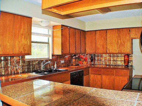 Granite countertops, Copper back splash and breakfast bar