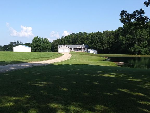 House, pond, and outbuilding