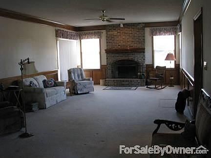 Living Room : Large living room, 15X25, with woodburning fireplace and lots of natural light.