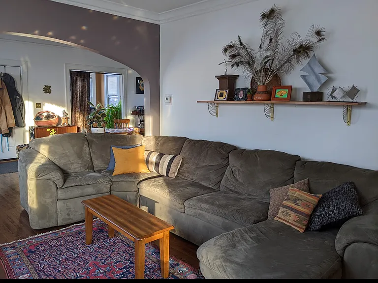 View of living room from entrance to kitchen
