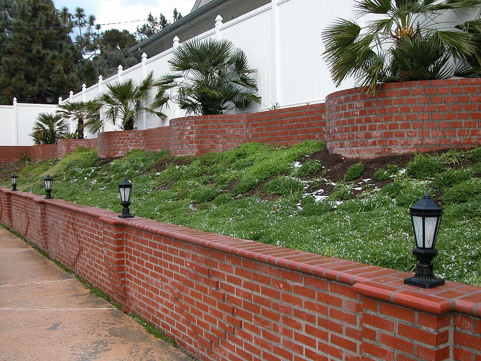 Backyard New Brickwork with White Vinyl Fence all Around