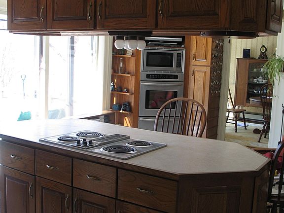 Built in jennaire stove with drawer cabinets pulls