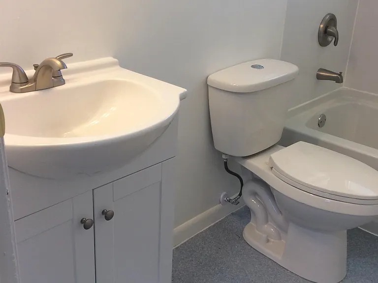 Completely remodeled bathroom with new tub, toilet, vanity,