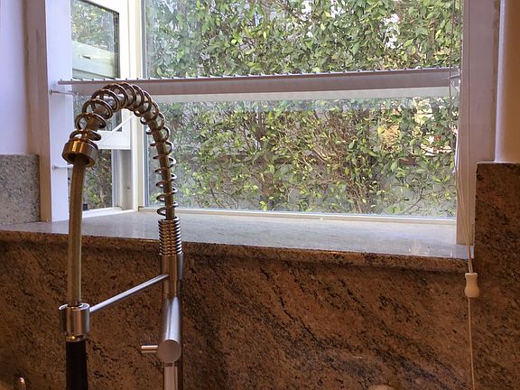 Greenhouse kitchen window for freshly grown herbs