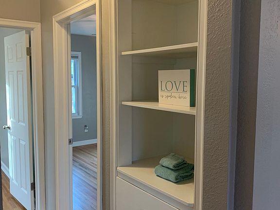 Linen storage with new, shiny nickel pulls.