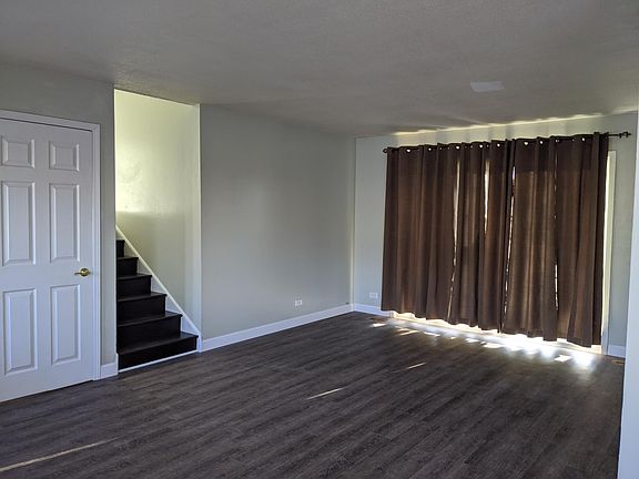 Living Area with Patio Door and Upstairs View