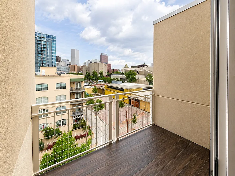 Private balcony with downtown views and outdoor living space.