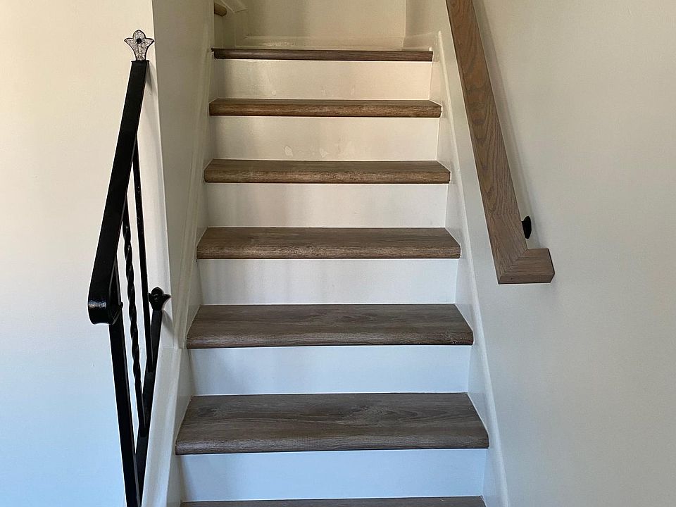 Stairway to second floor with custom railings to match the new floors.