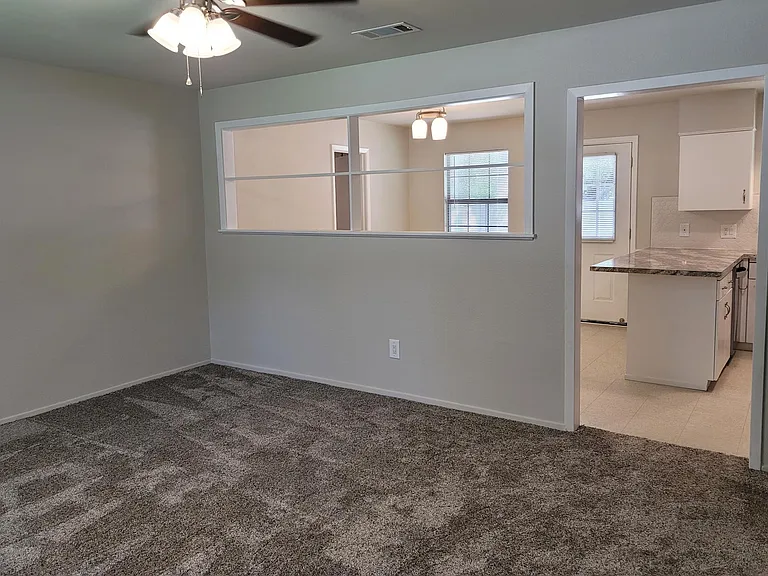 Large livingroom as seen from the front entrance with view into dining room.
Living Room 15'7"x13'2"
Dining Room 10'x11'1"