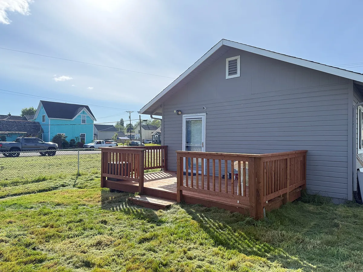 Fully fenced backyard. - 1003 E 1st St