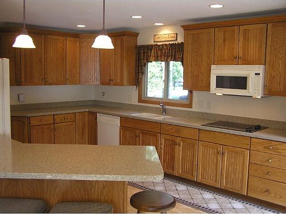 Truly a newer kitchen everyone should love. Space and silestone countertops open to dining area.
