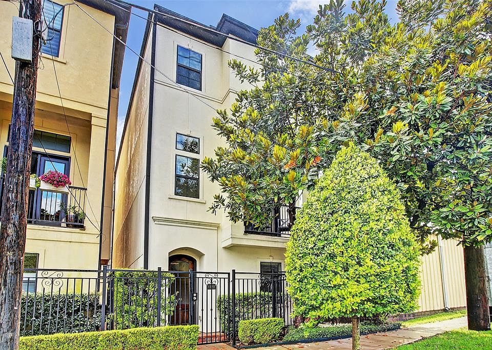 Free-standing 3 bedroom 3 1/2 bathroom home in booming Sawyer Heights has a private gated entrance from the street