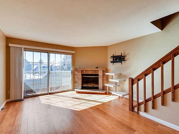 TV wall mount with built-in entertainment shelves. A large e-glass sliding door opens to a private deck. Prewired for speakers and cable.