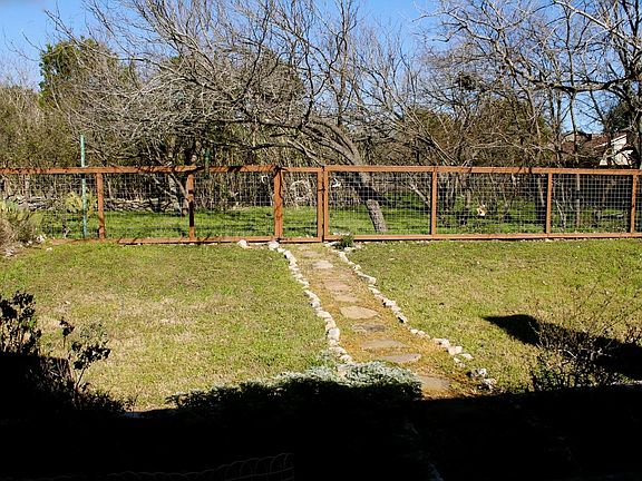 Backyard has gate which opens to Sunset Valley natural area.