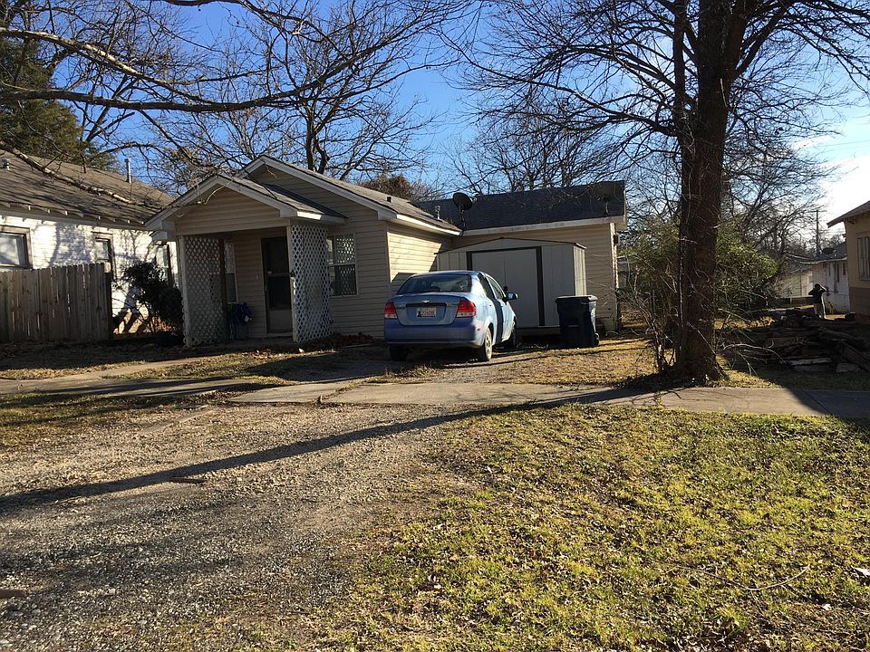 front of house with storage bldg.