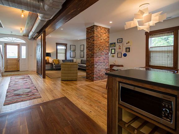 The downstairs is an open living plan with all the living, dining, and kitchen areas in one open space.