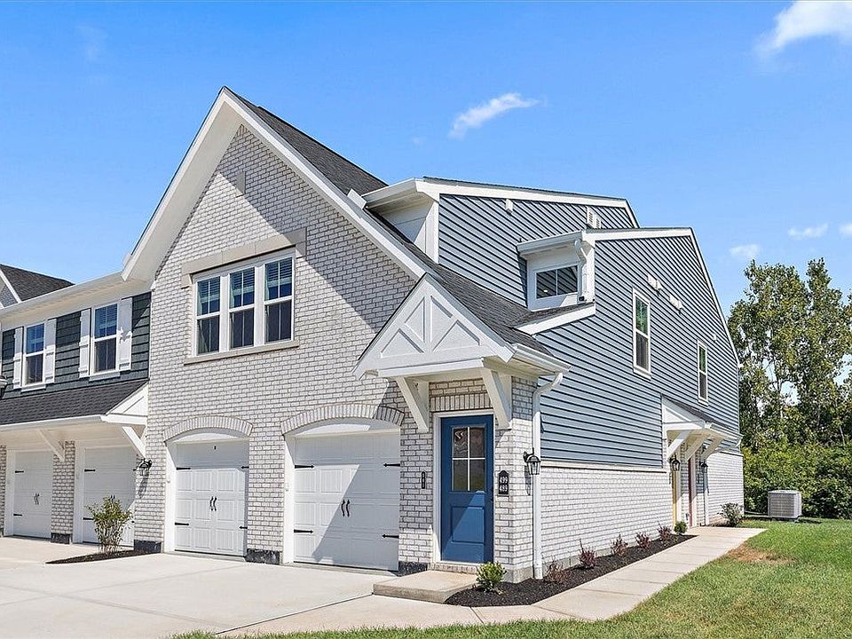 Crisp brick and siding accents define this contemp