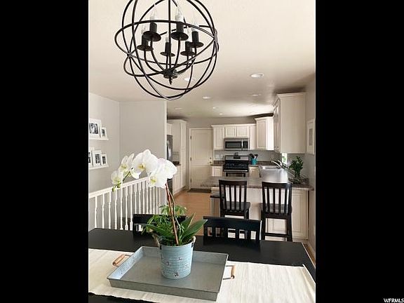 Bright and happy kitchen and dining room, with lots of can lighting. Matching stainless steel appliances.