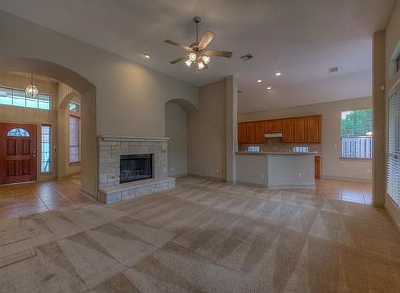 The great room has a built in niche to put an entertainment center or book shelf.  The fireplace is stone and has a nice sized hearth.  The gas fireplace makes it easy to be cozy in the winter.