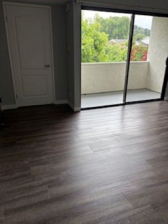 Living area, front closet, balcony