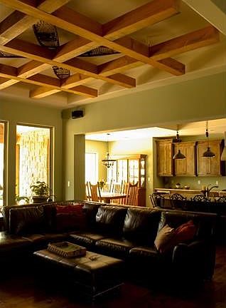 The pecan beams in the ceiling can be lowered and are cut for wiring on the top.